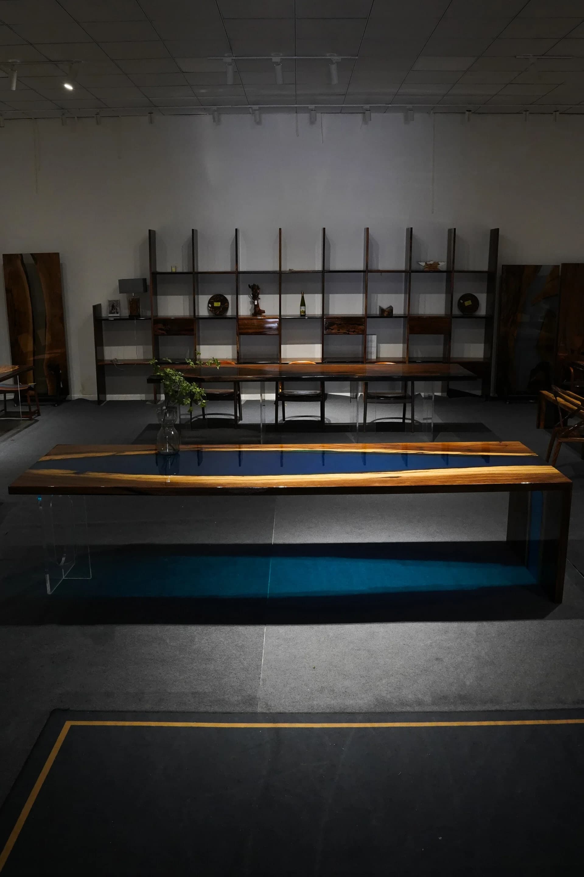 Waterfall dining table in South American walnut with blue resin falling over the edge, 320 by 100 centimetres
